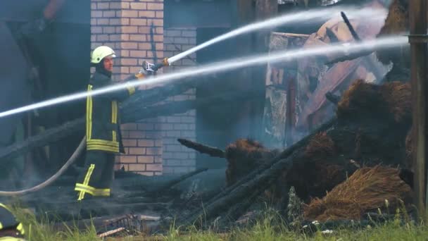 Fireman Extinguish Fire Hose Firefighters Put Out Burning Grain Forge — Stock video