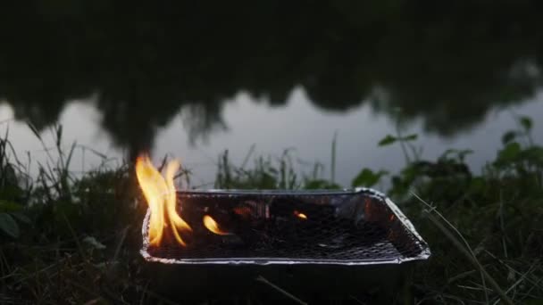 Close Video Charcoal Briquettes Burning Barbecue Grill Waterbody — Stock Video