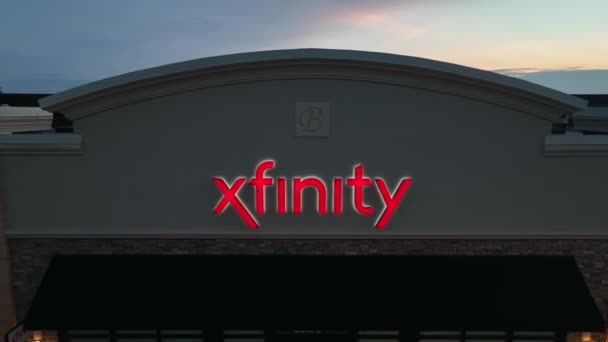 Xfinity Store Sign Night Aerial Pullback Company Logo — Stock Video