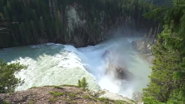 Large Waterfall Mountains Creating Mist Hits Large Mountainous Rocks — Stock Video