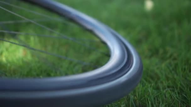 Slowmo Close Bike Wheel Spinning Blurred Background — Stock Video