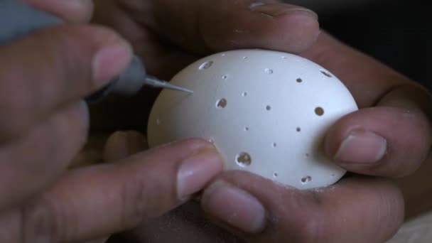 Closeup Person Carving Chicken Egg Using Drill Bare Hands — Stock Video