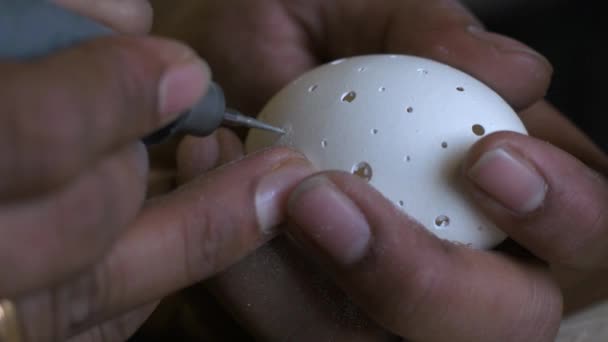 Closeup Person Carving Chicken Egg Using Drill Bare Hands — Stock Video