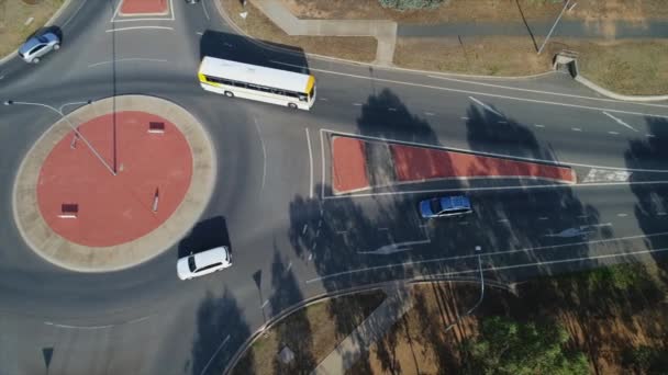 Aerial Topdown Cars Driving Roundabout Morning Sunlight Rural City Australia — Stock Video
