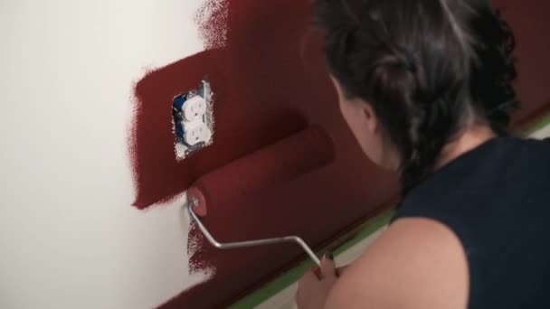 Young Woman Paints Red Wall House Home Improvement Project — Stock Video