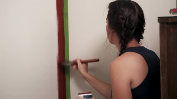 Young Woman Paints Red Wall House Home Improvement Project — Stock Video
