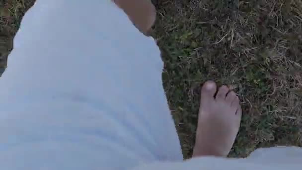 Pov View Man Bermuda Shorts Barefoot Walking Dry Grass — стоковое видео