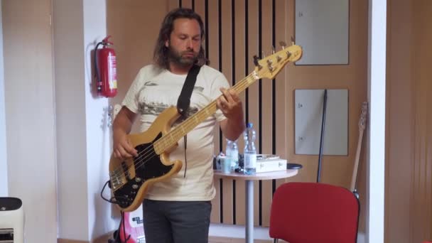 Man Playing Bass Guitar Recording Studio Medium Shot — Stock Video