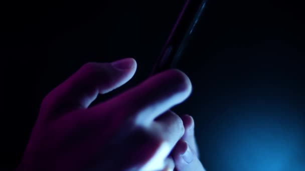 Thumb Scrolling Tapping Smartphone Close Side Profile Dark Room Purple — Stok Video