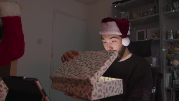 Male Overly Shocked Opening Christmas Present Which Lights Face — Stock Video