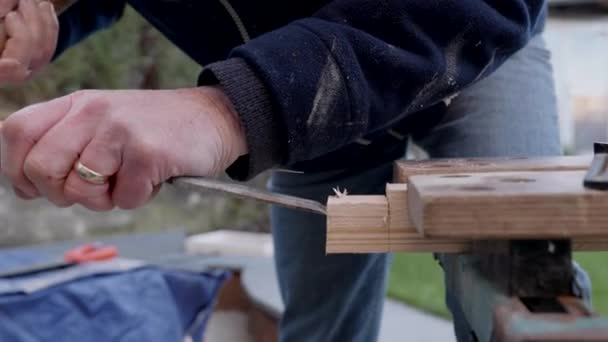Man Chiseling Wedge Wood — Stock Video
