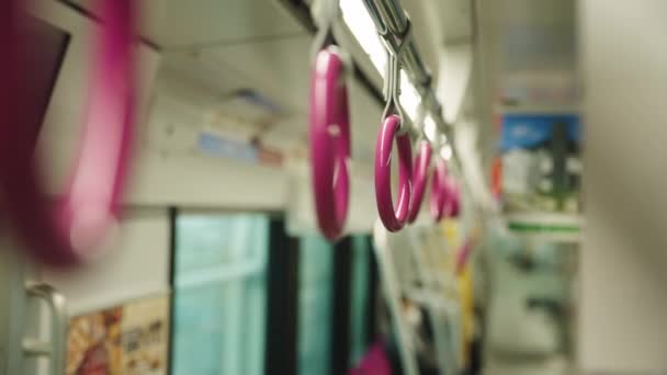 Train Interior Osaka Monorail Close Shot Standing Passenger Straps — Stock Video