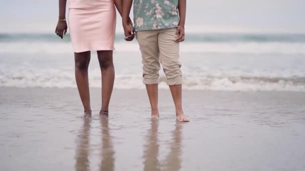 African American Couple Holding Hands Walking Beach Front View Two — Stock Video