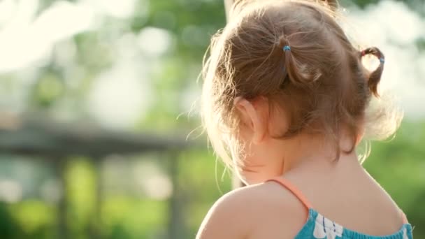 Young Little Girl Sitting Playground Summer Sunset Soft Light Eating — Stock Video