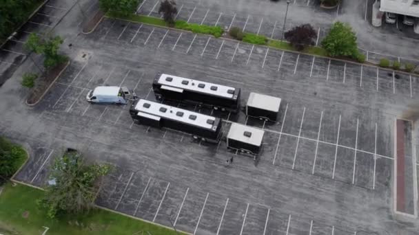 Aerial View Two Tour Buses Parked Parking Lot Tilt Drone — Stock Video