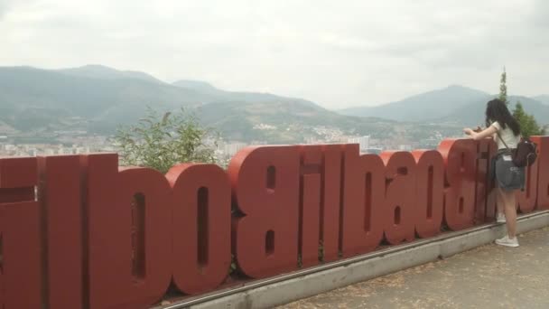 Medium Shot Girl Standing Red Sign Mirador Artxanda Marvelous View — Αρχείο Βίντεο