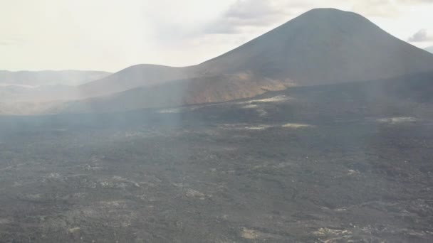 Volcano Eruption Smoke Fumes Revealing Rough Volcanic Lava Rock Terrain — Stock Video