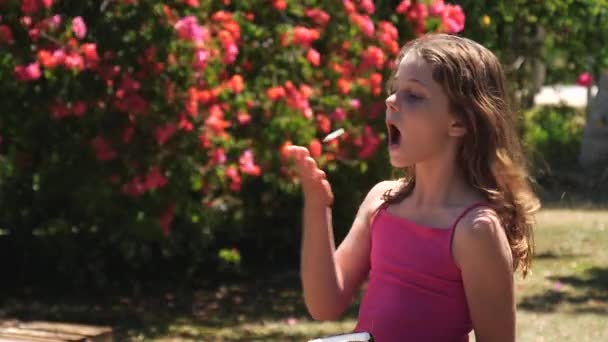 Young Girl Playfully Tries Toss Catch Pieces Raw Coconut Her — Stock Video