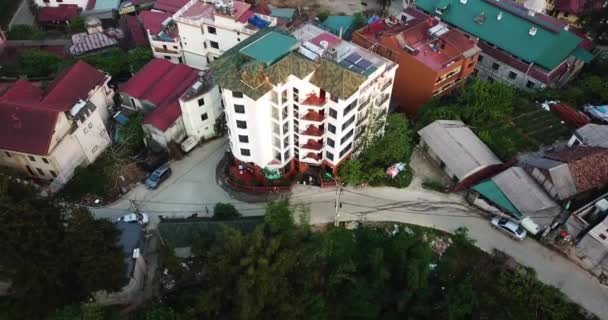 Descending Aerial Shot Focusing Small Apartment Block Reveals Larger Asian — Stock Video