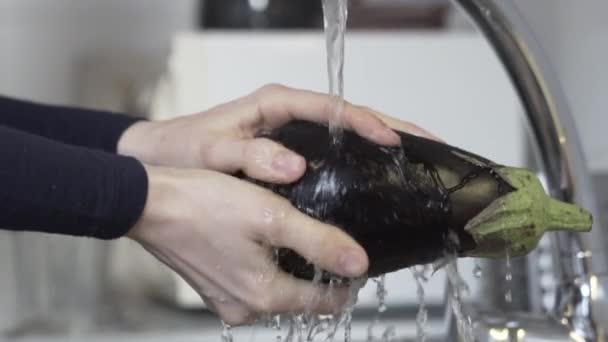 Close Slow Motion Shot Washing Eggplant Sink Water Preparation Cooking — Stock Video