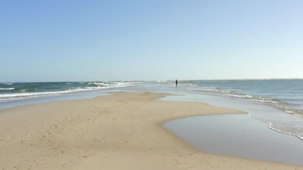 Lone Fisherman Out Sandbank Throwing His Line Out Sea Hopes — Stock Video