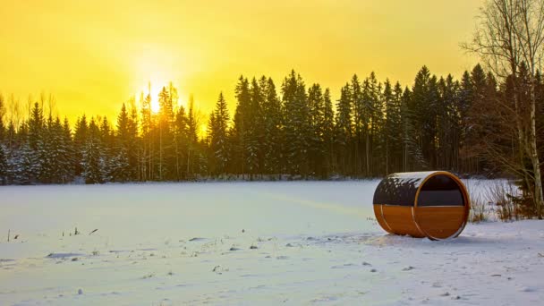Barrel Sauna Snowy Field Coniferous Forest Background Bright Yellow Sunset — 비디오