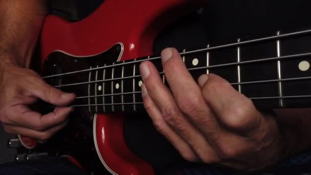Medium Close Shot Electric Bass Playing Using Right Thumb Hand — Stock Video