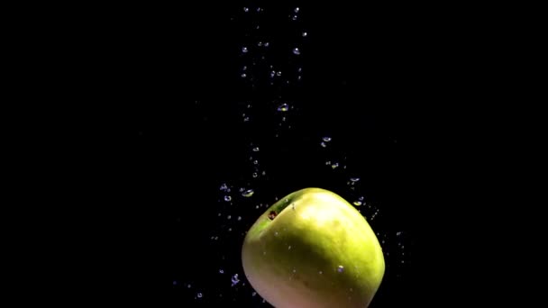 Apple Diet Concept Cinematic Shot Green Apple Falling Water Background — Stock Video