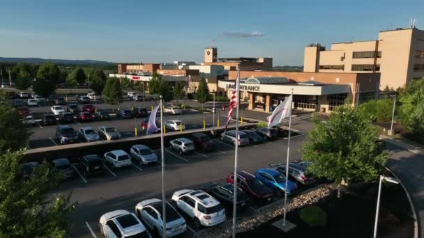 Mount Nittany Medical Center Building Flags Rising Aerial Reveal Shot — Stock Video