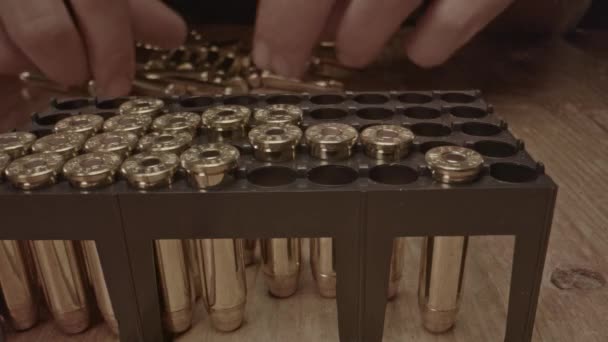 Hand Placing 357 Magnum Bullets Plastic Holder — Stock Video