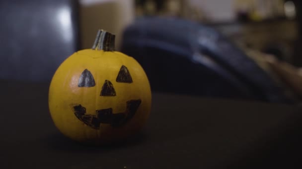 Scary Face Drawn Black Marker Small Yellow Pumpkin Close — Stock Video