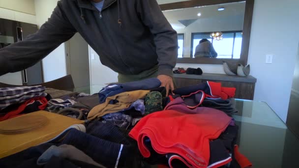 Casually Dressed Man Arranges School Clothes Table Slow Motion — Stock Video