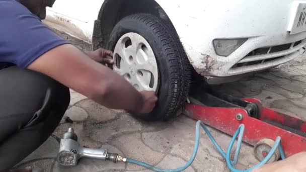 Car Mechanic Worker Doing Tire Wheel Replacement Pneumatic Wrench Garage — Stock Video
