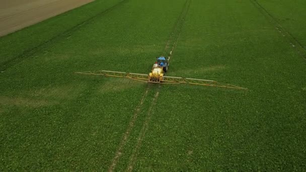 Flying Tractor Pull Type Sprayer Traveling Straight Line Spraying Crop — Stock Video