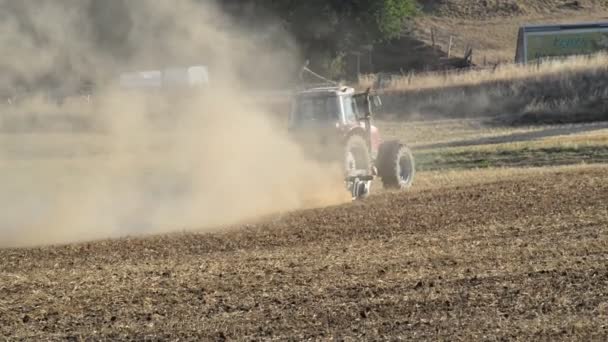 Red Tractor Plowing Rock Hard Dried Out Field German Countryside — Stock Video