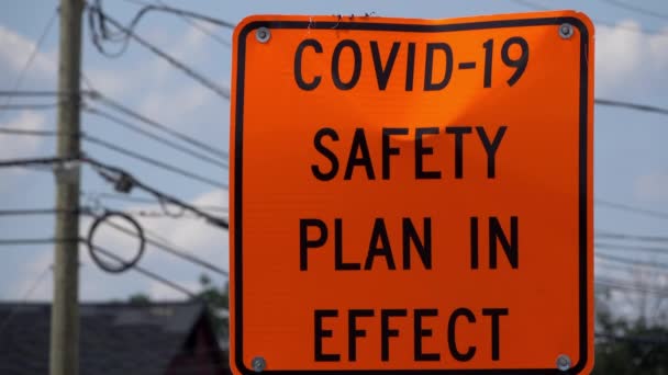 Covid Safety Sign Safety Orange Stands Roadside — Stock Video