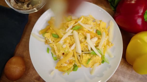Top View Shredded Cheese Being Sprinkled Plate Bright Yellow Scrambled — Stock Video