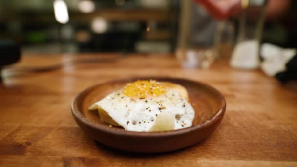 Fried Egg Toast Seasoned Salt Pepper Slow Motion — Stock Video