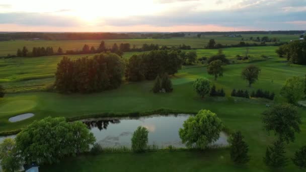 Beautiful Golf Course Countryside Golden Sunset Aerial Arc Shot — Stock Video