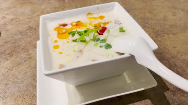 Delicious Tom Kha Gai Thai Soup White Bowl Spoon Dolly — Stock Video