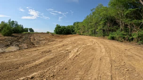 Single Bulldozer Works Build Side Walls Large Pond New Development — Stock Video