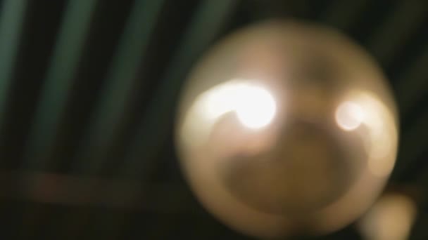 70S Glitterball Slowly Spinning Creating Lens Flares Reflecting Light Camera — Stock Video