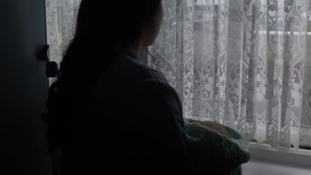 Silhouette Young Mother Cradling Her Newborn Baby Her Arms Windowsill — Stock Video