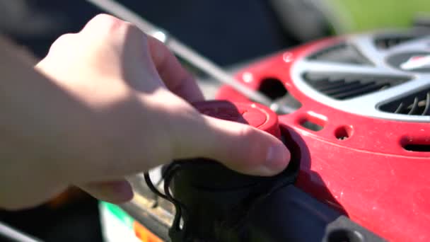 Caucasian Hand Removes Red Gas Cap Lawn Mower Close Shot — Stock Video