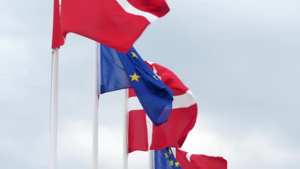 Close Gimbal Shot Danish European Union Flags Cloudy Sky — Stock video