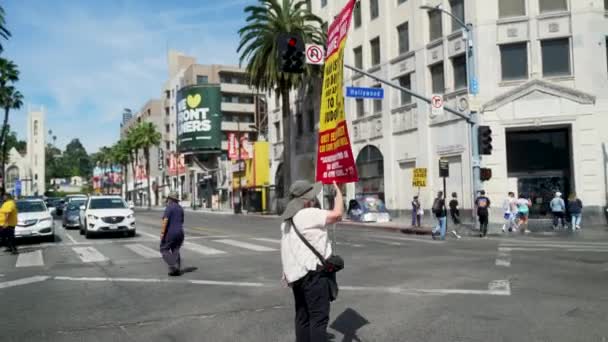 Christian Extremist Holds Religious Sign Middle Hollywood Boulevard — Stock Video