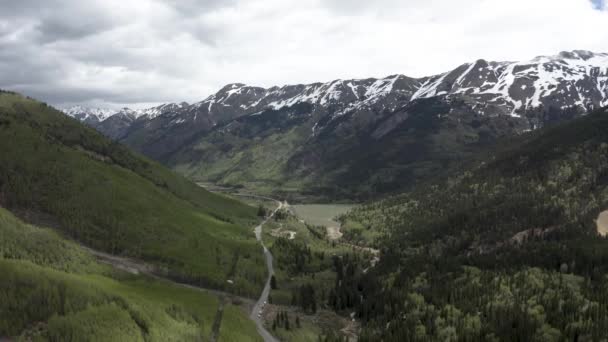 Colorado Rocky Mountains Snowed Peaks Small Lake Aerial Flyover Shot — Stock Video