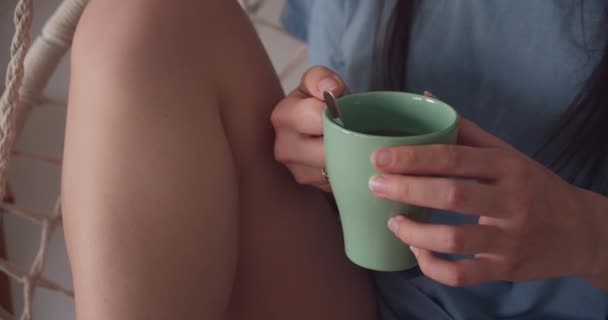 Girl Holding Cup Tea While Sitting Relaxing Swing Chair Close — Stock Video