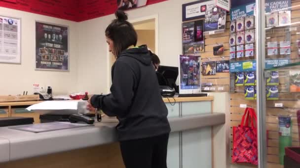 Motion Woman Mailing Parcel Post Office Shopper Drug Mart Store — Video