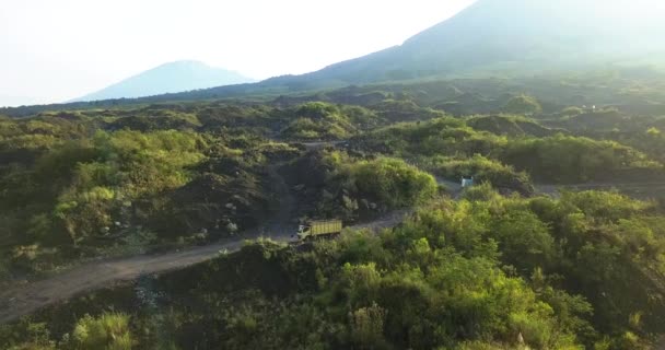 Reveal Drone Shot Trucks Driving Sand Mine Slope Volcano Morning — Vídeos de Stock